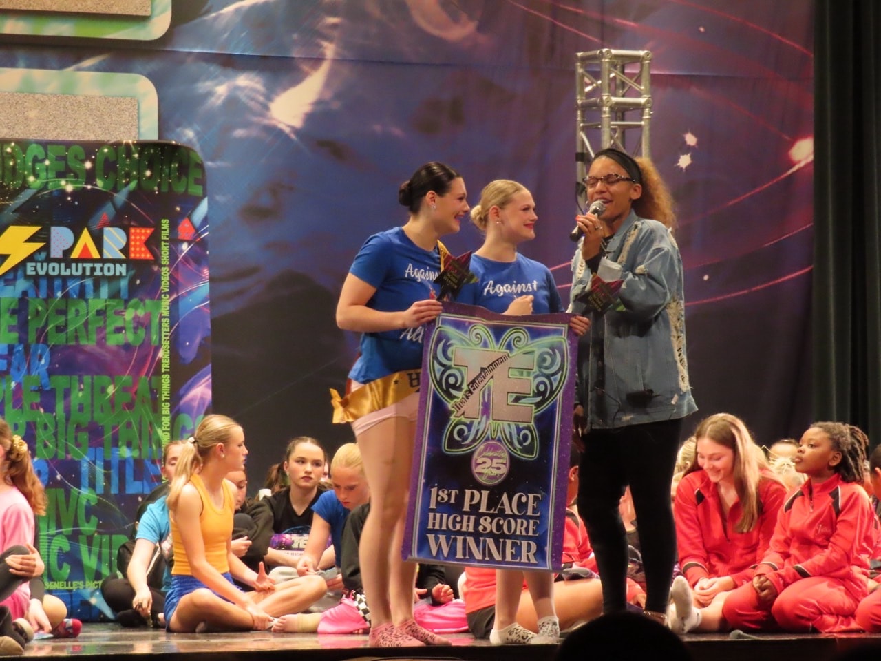 Turn Out Dance Academy performers receiving a first-place high score award on stage