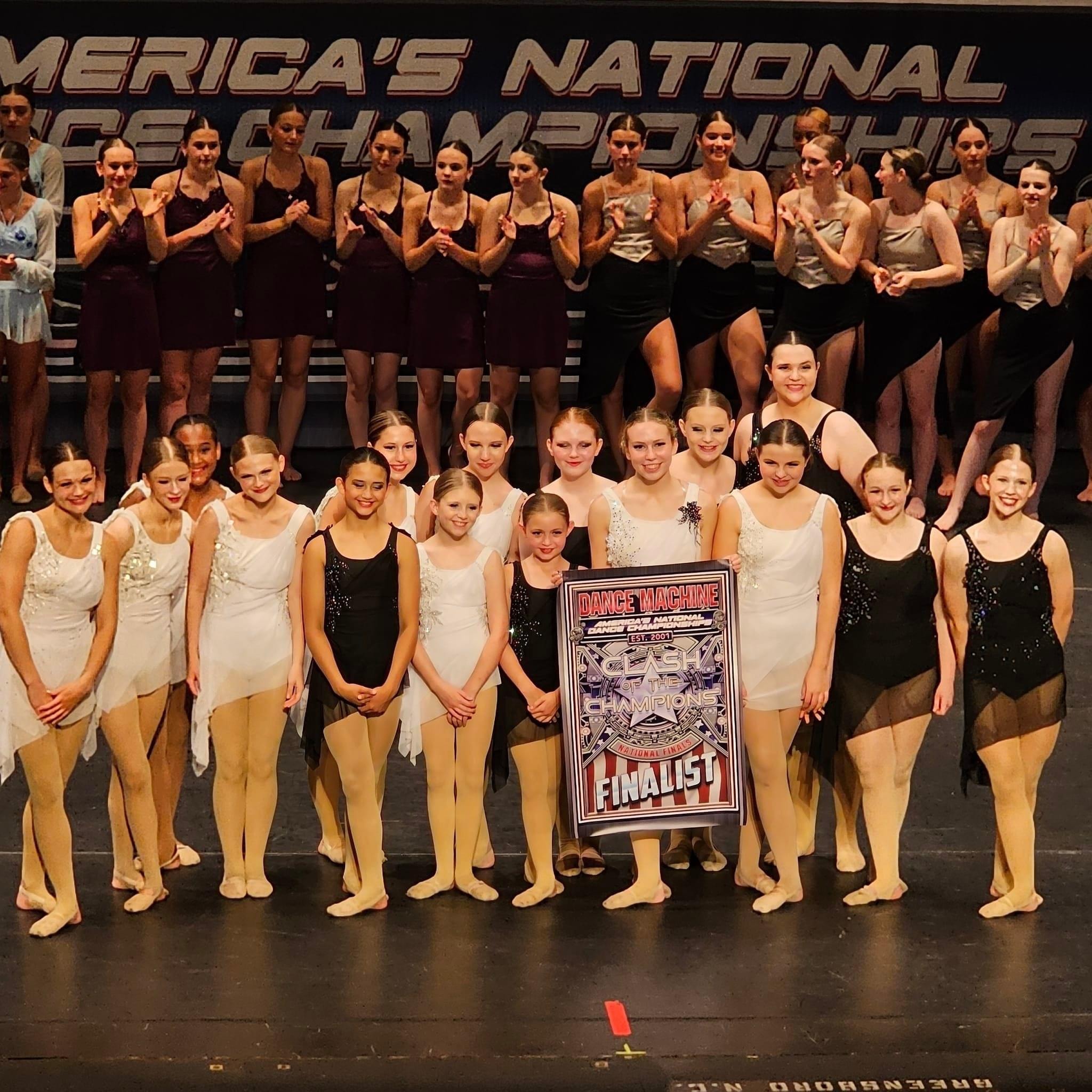 Turn Out Dance Academy team celebrating as national finalists on stage