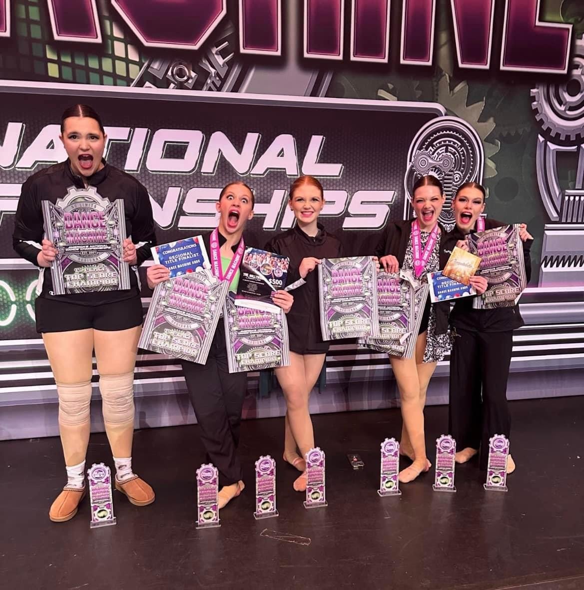 Turn Out Dance Academy dancers holding awards and certificates