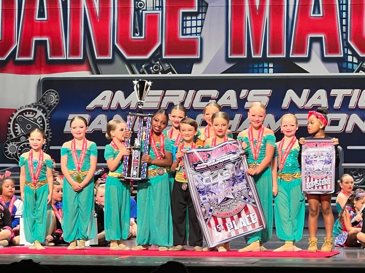 Youth Turn Out Dance Academy team receiving trophies and awards