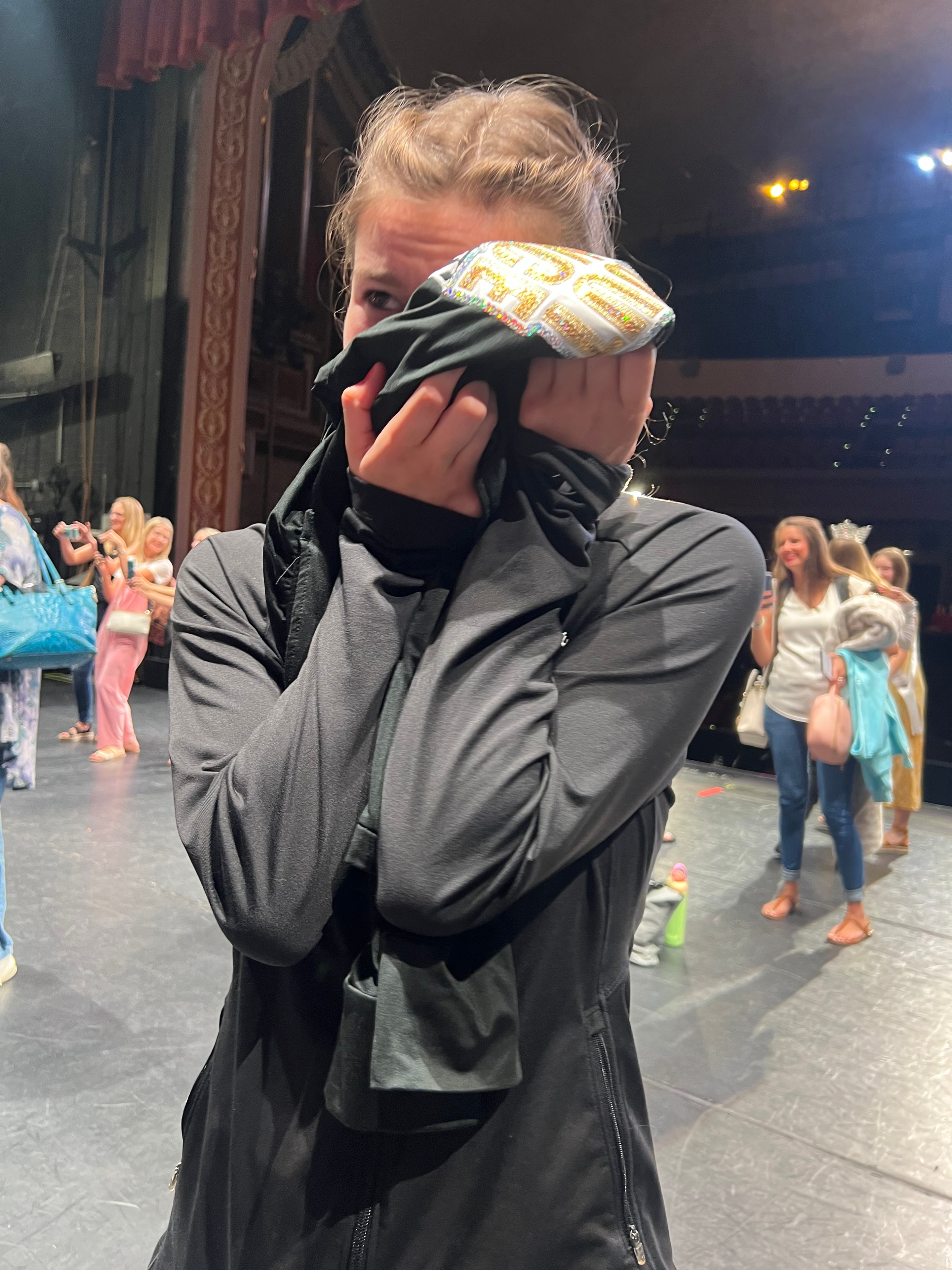 Turn Out Dance Academy performer in costume sharing a candid stage moment