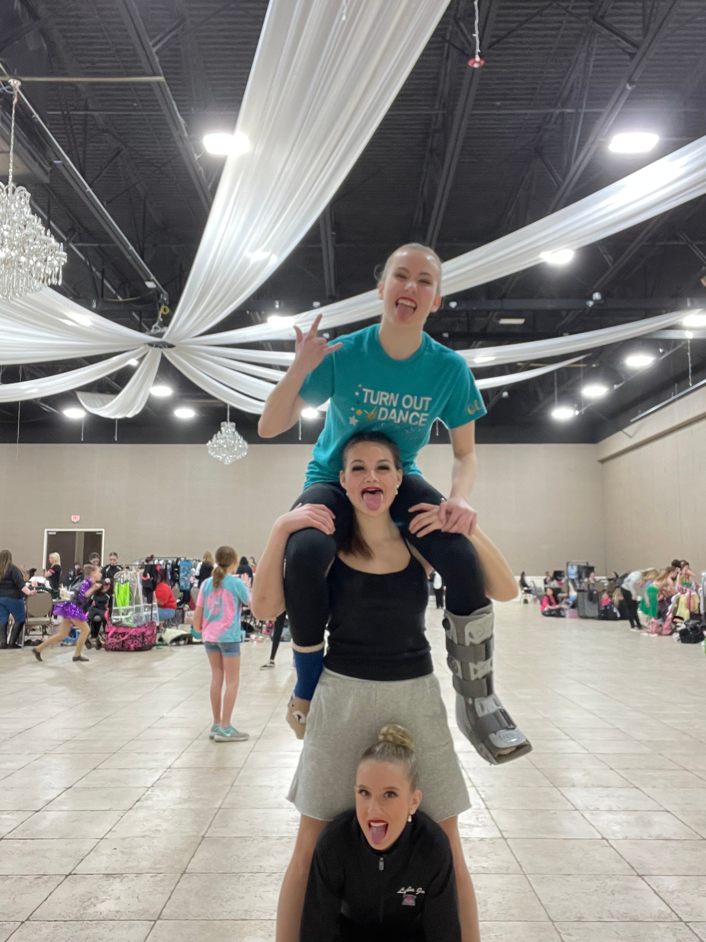 Turn Out Dance Academy friends posing playfully together at a dance venue