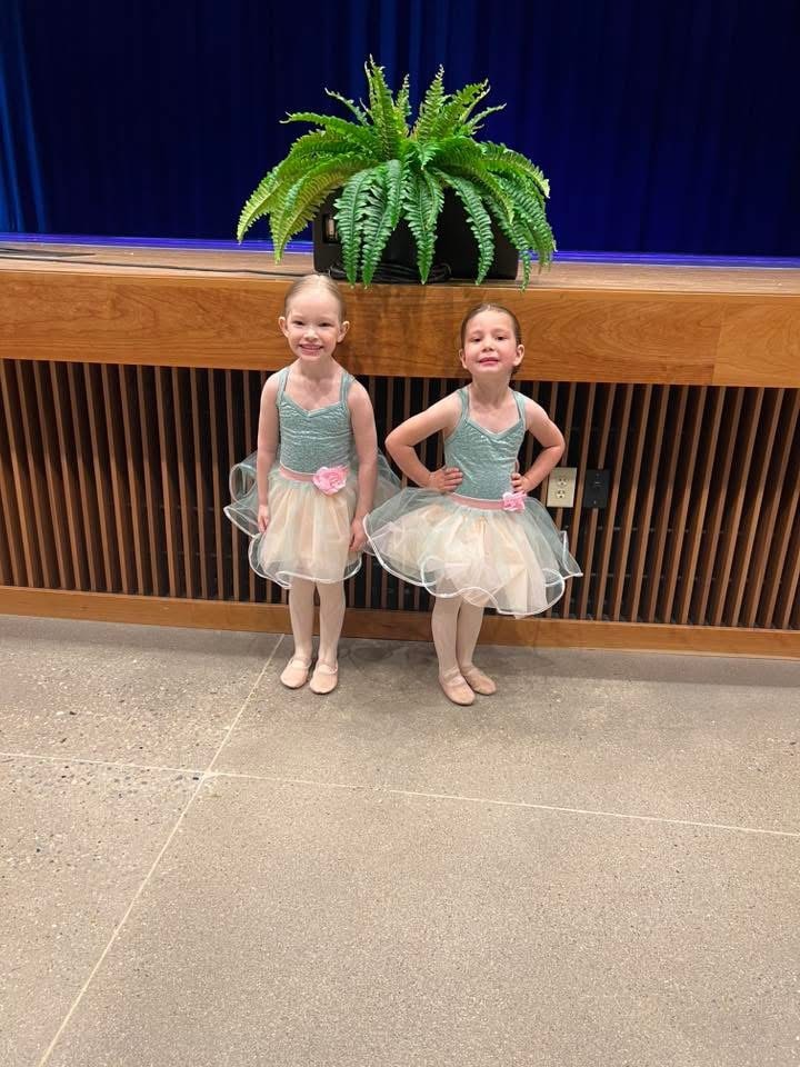 Dancers celebrating a recital performance at Turn Out Dance Academy